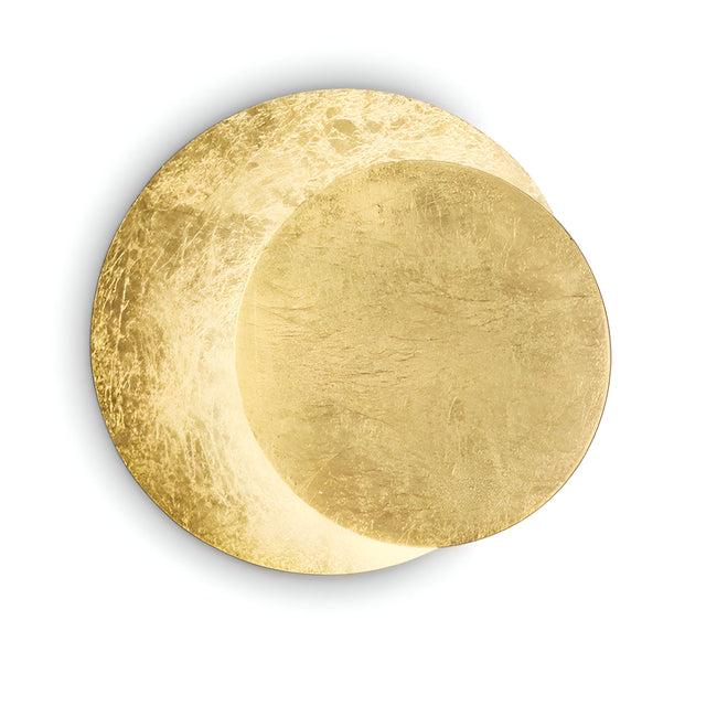 A pair of overlapping golden discs with a textured surface against a plain white background form an abstract, luminous composition. With a modern silhouette akin to the Aurix LED Wall Light 7.5W 3000K in Gold, they feature an irregular gold finish and reflective quality.