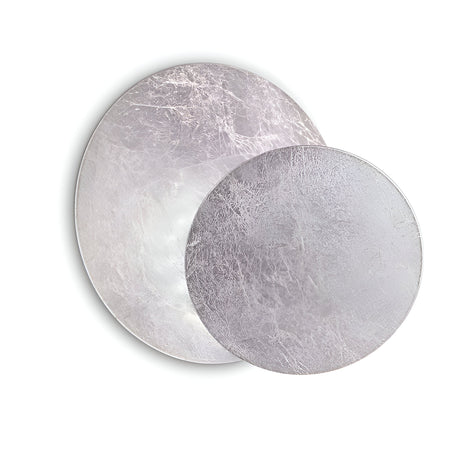 Description: An artistic depiction of two intersecting circular forms in varying shades of grey, emulating the chic design of the Aurix LED Wall Light 7.5W 3000K in silver. The textured, crackled surfaces enhance its sophisticated charm, while the minimalist white backdrop emphasizes its modern aesthetic.