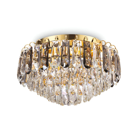 The Flair 7 Light Crystal Chandelier - Gold boasts a luxurious circular design with an enchanting array of pendants. Its golden fixture and brilliantly reflective crystals create a captivating sparkle.