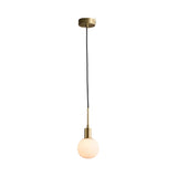 The Astra 1 Light Alabaster Single Pendant Light in soft white and brushed brass features a minimalist design with an alabaster globe shade, brass-finished socket and ceiling mount, and a sleek black cord.
