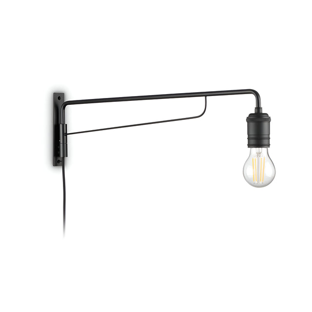 The Lustria Wall Light - Black is a sleek, wall-mounted fixture with a minimalist design featuring an exposed bulb and refined black finish. Its elongated, slender arm projects outward, seamlessly merging industrial style with modern aesthetics through its distinct visible filaments.