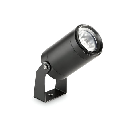 The Solarium LED Outdoor Single Spotlight 5.5W 3000K in black features a cylindrical design, IP86 weatherproof protection, and an adjustable bracket mount. It is shown angled upward on a white background.