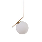 Niori Vetra Opal Glass Pendant Light in brushed gold, featuring a slim angled arm holding a 30cm opal glass globe off to one side, on a white background.