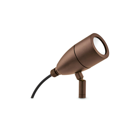 The Radiata Outdoor Single Spotlight in brown is a durable outdoor light featuring a bronze finish with a cylindrical shape and an adjustable head. It comes with a black cable extending from the back.