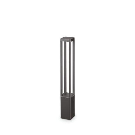 Introducing the Starlux Outdoor LED Bollard Light, a contemporary and minimalist lighting solution crafted from die-cast aluminum. This lamp features a sleek, tall rectangular frame with a sophisticated grey finish. Its open design is characterized by vertical bars that elegantly rest on a square base, while its IP65 rating guarantees durability in all weather conditions. Standing at 65 cm tall and offering a warm light of 3000K with an 8W LED, it adds both style and functionality to your outdoor space.