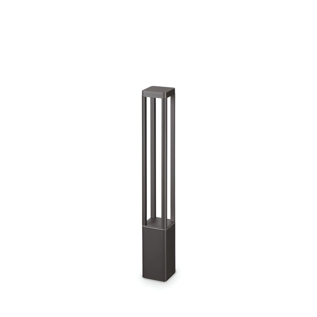 Introducing the Starlux Outdoor LED Bollard Light, a contemporary and minimalist lighting solution crafted from die-cast aluminum. This lamp features a sleek, tall rectangular frame with a sophisticated grey finish. Its open design is characterized by vertical bars that elegantly rest on a square base, while its IP65 rating guarantees durability in all weather conditions. Standing at 65 cm tall and offering a warm light of 3000K with an 8W LED, it adds both style and functionality to your outdoor space.