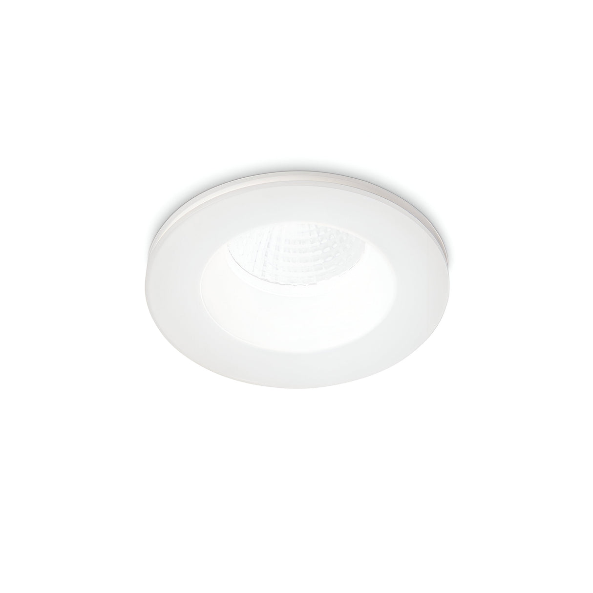 An Omera LED Round Recessed Downlight 8W 3000K in white, featuring a clear diffuser, is installed in a clean, plain ceiling. The light is on, providing bright illumination that perfectly complements the contemporary interior.