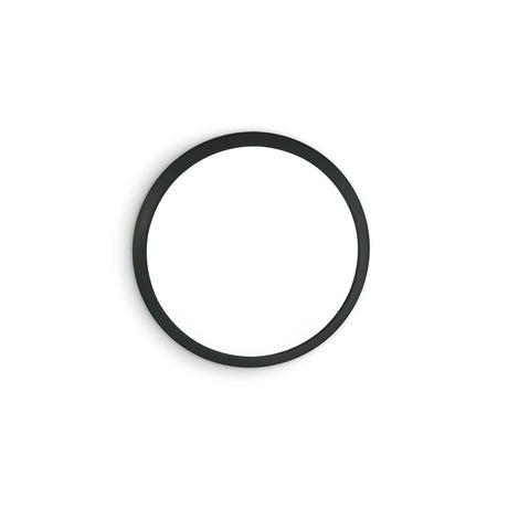 A round white disc featuring a black border, akin to minimalist wall decor or an abstract art installation, closely resembles the Mono LED Flush Ceiling Light 12W 3000W - Black, with a diameter of 29cm, displayed against a plain white background.