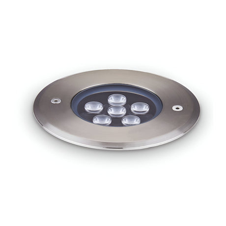 The Emberwave LED Drive Over Outdoor Recessed Ground Light 6W 3000K - Grey, measuring 12cm, features a round design with LED technology providing energy efficiency. This fixture is crafted to be flush with its installation surface and boasts an IP67 rating for enhanced durability and optimal lighting performance.