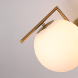 The Vetra 1 Light Opal Glass Wall/Semi-Flush Ceiling Light in gold features a round white opal glass shade and gold metal arm, adding an elegant touch to any light-colored wall or ceiling.