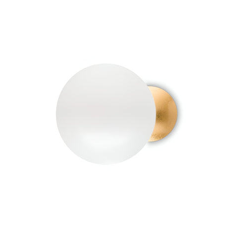 The Ocean Wall Light - White features a minimalist design with a frosted glass globe and brass backing, beautifully contrasted against a simple white background. Its adjustable upper diffuser adds a modern flair, enhancing the understated elegance of the piece.