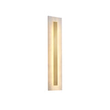 The Averra LED Medium Rectangle Alabaster Wall Light in soft white and brass features a central vertical cutout, casting a warm, elegant glow—perfect for contemporary interiors.