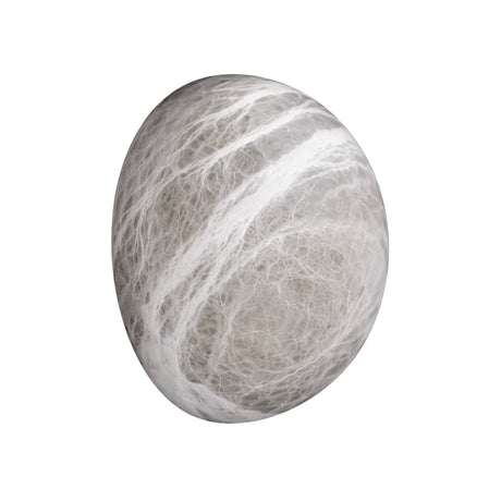 A smooth, round gray stone with white, marble-like streaks recalls the elegant look of the Orvani LED Medium Oval Alabaster Wall Light - Soft White, inspired by natural Spanish alabaster, on a white background.