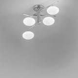 Dolce 4 Light Glass Ceiling Light, a flush fitting with four white oval glass shades on angled chrome arms radiating from a central ceiling rose, shown against a plain grey background.
