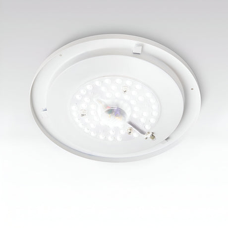 A close-up of the Mirage LED Ceiling & Wall Light 22.5W 3000K – White, 40cm showcases its energy-efficient illumination with multiple small bulbs arranged in a circular pattern. This versatile fixture seamlessly integrates with the flat white ceiling, combining modern design with functionality.