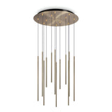 The Celestia 12 Light LED Cluster Pendant showcases a sleek and minimalist design with its circular metal base in brass finish, featuring multiple thin, elongated light rods hanging at varying lengths. This 25W, 3000K fixture embodies modern elegance in lighting.