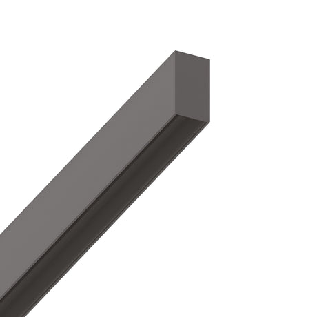 A black, rectangular metal beam of aluminium construction is suspended against a white background, shown from an angled perspective. The Luxeon Surface-Mounted Track 2m - Black features a smooth, uniform surface with sharp edges, offering a solid, minimalist design suitable for magnetic lighting.