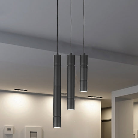 Turbo Cylinder Pendant Light 40cm shown as three slim black metal tubes at staggered heights above a kitchen counter with downlights in a light grey ceiling.
