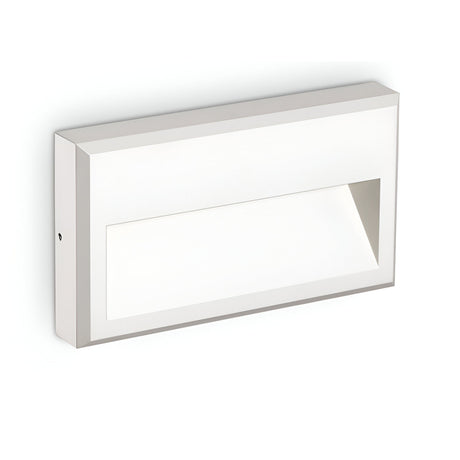 Presenting the Arcana-1 LED Outdoor Wall Light 6W 3000K - White: a modern rectangular fixture featuring a beveled cut-out design. This energy-efficient outdoor lighting solution boasts clean lines and a minimalist aesthetic, making it an ideal choice for contemporary outdoor spaces.