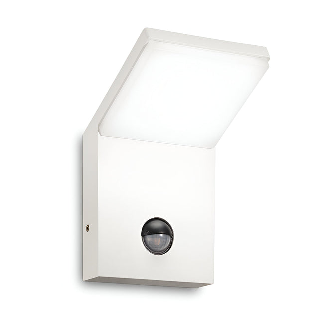 The Brillix Outdoor Motion Sensor LED Wall Light 9.5W 3000K - White showcases a modern square design and includes an outdoor motion sensor centrally positioned at the bottom. It is weather-resistant and directs light downward, providing a sleek and minimalist aesthetic.