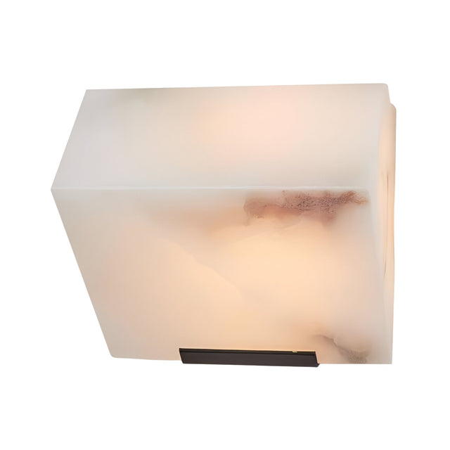 The Glorina LED Alabaster Wall Light – Soft White is a rectangular, white Spanish alabaster sconce with natural brown veining and a dark metal base accent, casting a soft glow for modern wall lighting style.