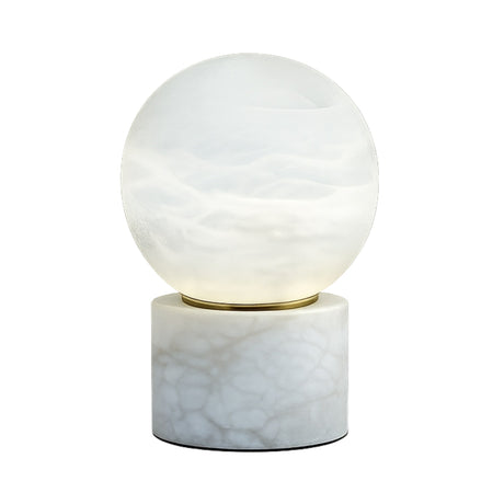 The Aurion LED Large Globe Alabaster Table Lamp features a modern, round soft white glass globe on a cylindrical alabaster base with natural veining.