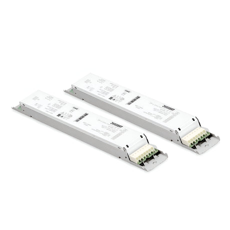 Two Sparx Constant Voltage Dimmable LED Drivers - 54W with rectangular white casings feature printed specifications and branding. Equipped with multiple terminal connectors on one end for wiring connections, they are ideally suited for constant voltage applications, and are displayed side by side against a plain white background.
