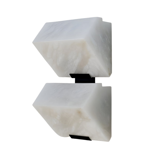 The Calyrix LED Small Stacked Alabaster Wall Light – Soft White features two rectangular alabaster-inspired shades facing opposite ways, mounted on a sleek black metal fixture for a modern sculptural look.