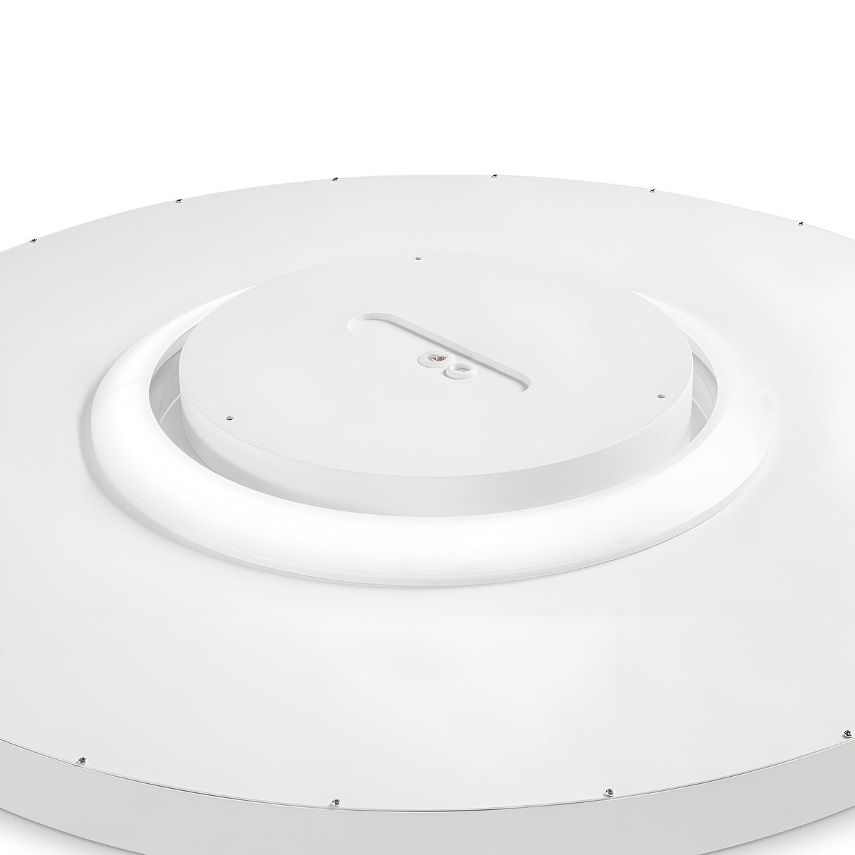 A close-up of the Twilight LED Ceiling Light 12W 3000K - White, 90cm reveals a sleek, modern design with energy efficiency. The fixture boasts a central circular element surrounded by a glowing 3000K ring. Its surface is smooth and minimalistic, complemented by evenly spaced screws that enhance its sophisticated appeal.
