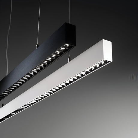 In a minimalistic setting, two ceiling-mounted rectangular linear lights with integrated LED technology, identified as the Celine LED Linear Suspension 30W 3000K - Black and its white counterpart, are suspended by wires. This modern design showcases the lights parallel to each other against a gray background.