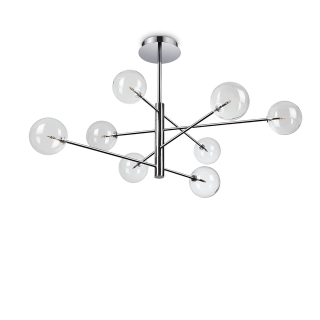 The Solarae 8 Light Suspension - Silver is a contemporary lighting fixture with a polished silver finish and metallic frame. It features eight clear glass globe lights suspended at various angles to create a geometric design. The transparent glass diffusers add an element of elegance, and it is all mounted on a circular ceiling plate.