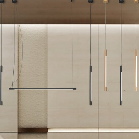 Index Cylinder Pendant Light 8cm, slim LED tube pendants in black, gold and champagne metal finishes, shown at varying drop heights against a beige wall.