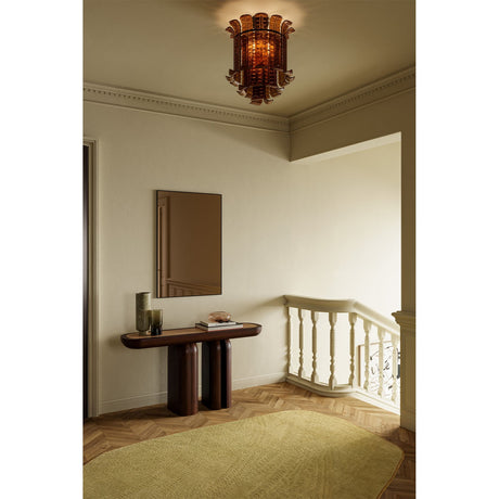 Lucka Bronze Tinted Rectangular Wall Mirror, 120cm, slim black metal frame, hung above a dark wood console table in a hallway with staircase.
