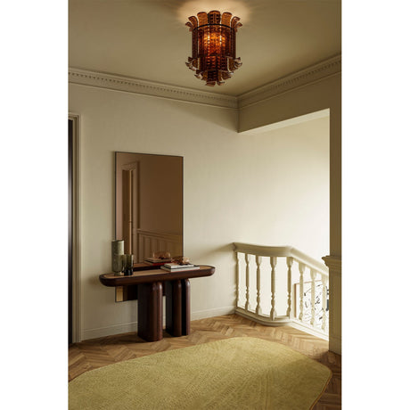 Lucka Bronze Tinted Full Length Mirror 175cm in a slim black metal frame, mounted above a dark wood console table in a hallway with a ceiling pendant light.