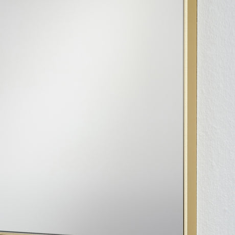 Close-up corner view of the Lucka Gold Slim Framed Full Length Mirror, showing the slim gold metal frame edge against a plain white wall.