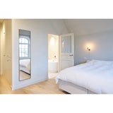 Lucka Black Slim Framed Full Length Mirror, 175cm rectangular mirror in a slim black metal frame, mounted on a bedroom wall reflecting a window.