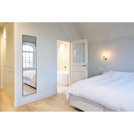 Lucka Black Slim Framed Full Length Mirror, 175cm rectangular mirror in a slim black metal frame, mounted on a bedroom wall reflecting a window.
