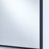 Close-up of the Lucka Black Slim Framed Full Length Mirror's top corner, showing the slim black metal frame flush against the glass, mounted on a white wall.