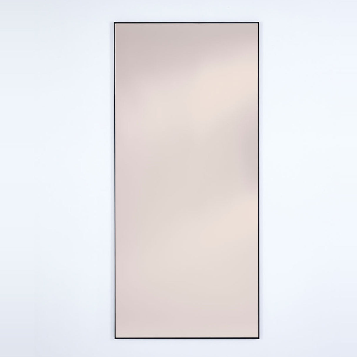 Lucka full-length wall mirror, 175cm rectangular design with slim black metal frame and bronze-tinted glass, shown on a plain light background.