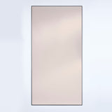 Lucka full length mirror, rectangular, bronze tinted glass in a slim black metal frame, on a plain light background.