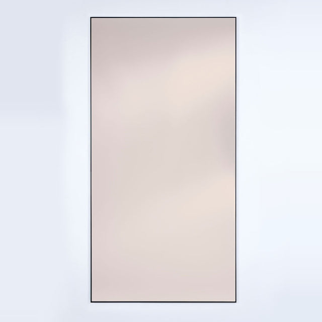 Lucka full length mirror, rectangular, bronze tinted glass in a slim black metal frame, on a plain light background.