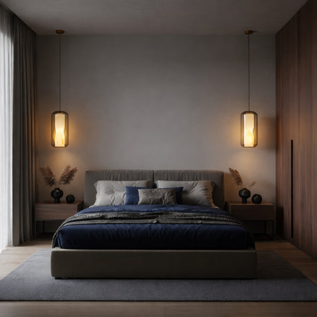 A modern bedroom with a large bed, dark blue bedding, gray headboard, and wooden nightstands features globe lamps and a Vale 1 Light Faceted Alabaster Single Pendant Light in Soft White. Neutral tones and soft lighting add coziness over the wood floor and gray rug.