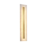 The Averra LED Large Rectangle Alabaster Wall Light in soft white and brass features a modern rectangular design with a frosted alabaster surface and central translucent panel, casting a gentle warm glow.