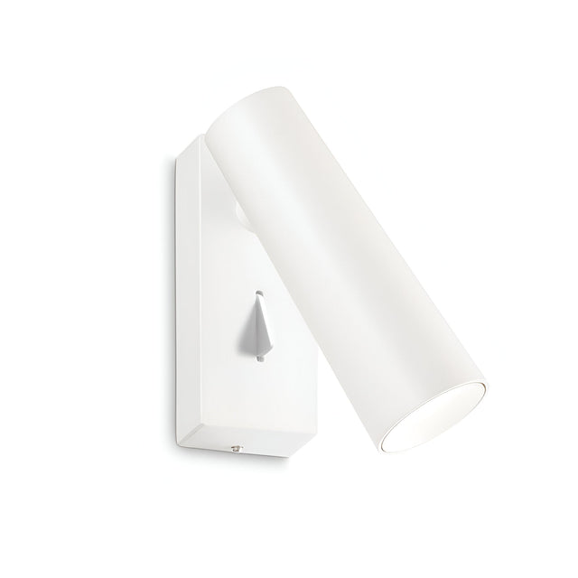 Introducing the Radiant LED Single Spotlight 7W 3000K in White—a sleek, wall-mounted cylindrical lamp that combines energy-efficient LED technology with a contemporary design. It features an adjustable angle and comes mounted on a rectangular base, complete with an adjustable diffuser for optimal lighting. A small triangular switch on the base allows for effortless control, enhancing its minimalist appeal.