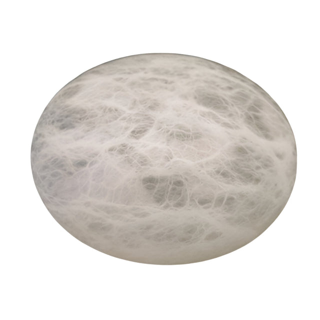 The Caldera Large Pebble Alabaster Table Lamp in Soft White features a smooth, round alabaster surface with delicate, web-like patterns, creating a sculptural look against a plain white background.