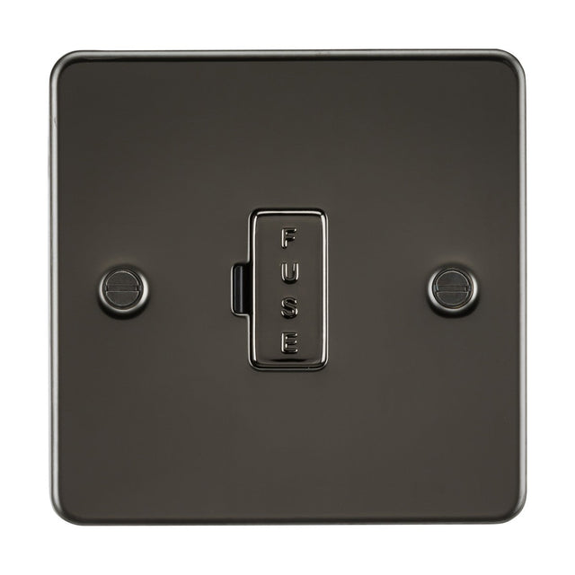 The 13A Fused Spur Unit in gunmetal features a black metal switch with two screws and a FUSE labeled button. Its ultra-low profile flat plate design seamlessly combines style and function.