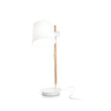 The Twine Wood Table Lamp - White is a contemporary table lamp that showcases a white shade and wooden stand on a round base. The power cord is visible, extending from the shade to the base. Its sleek lines highlight modern design, while its adjustable lighting provides practicality within its minimalist aesthetic.