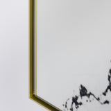 Close-up of the gold frame corner where it meets the glass, with a heavy black vein running behind it.