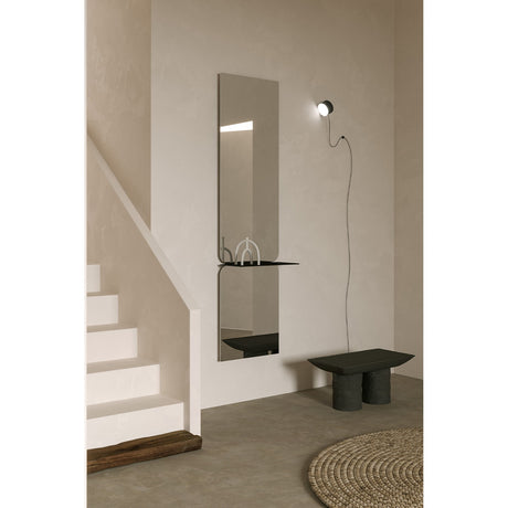 Taille full length hall mirror, 180cm rectangular frameless design in two mirrored panes with a black metal shelf at the join, shown mounted in a hallway near a staircase.