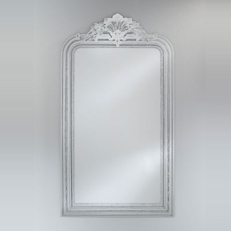 Haussmann full length mirror with arched moulded frame and scrolled crest detail, white distressed finish, rectangular glass, shown against a plain light background.